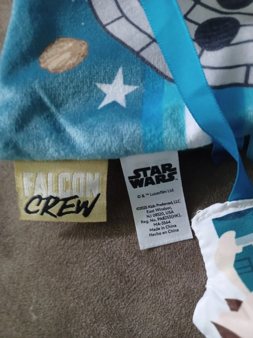 Star Wars Blue Space Bib with Falcon Graphic and Orange Teether